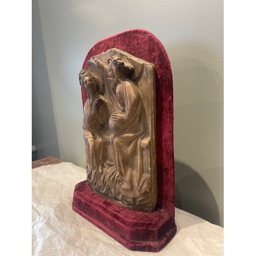 99 - A 15th century Nottingham alabaster panel sculpture. On burgundy velvet stand. Traces of original po... 