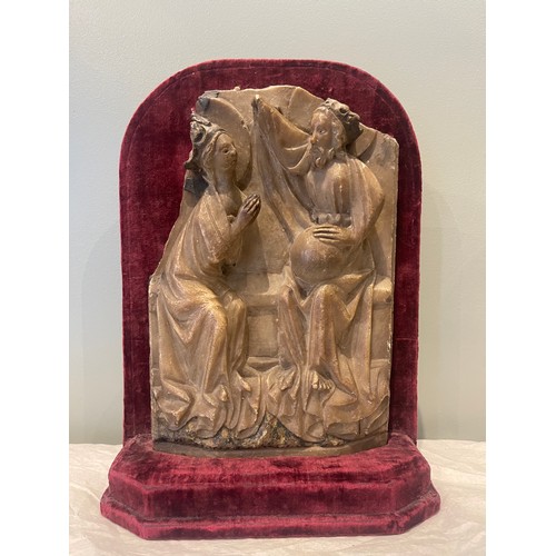 99 - A 15th century Nottingham alabaster panel sculpture. On burgundy velvet stand. Traces of original po... 