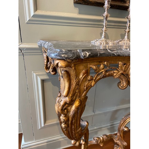 6 - Italian gilt-wood serpentine console table with later Bardiglio grey marble top. Mid-18th Century.Ex... 