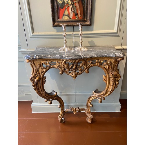 6 - Italian gilt-wood serpentine console table with later Bardiglio grey marble top. Mid-18th Century.Ex... 