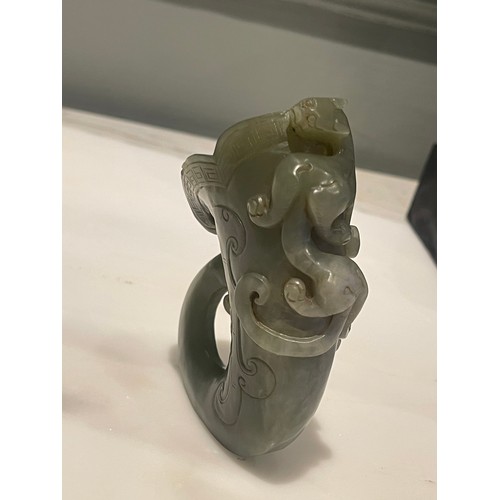 38 - An antique Chinese Jade Horn with a Climbing Dragon.Measurements:4.5 in (H) x 3 in (W)... 