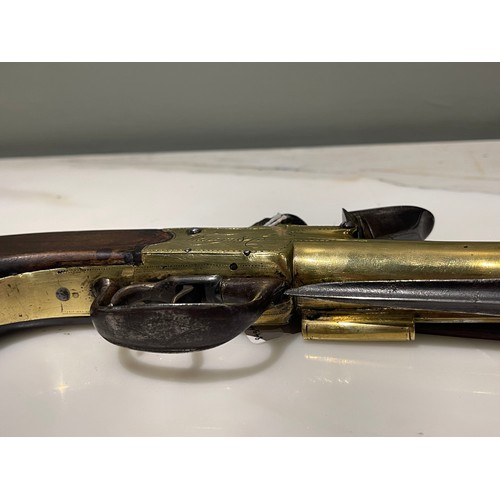 86 - A Naval Flintlock Blunderbuss Pistol. By John Waters & Co, c. 1790. With patent spring bayonet. ... 