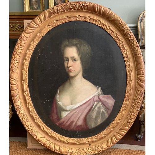 213 - Property of a GentlemanAn Oval Portrait of A Young Lady, British, 18th century. In a carved and gild... 