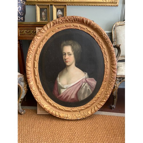 213 - Property of a GentlemanAn Oval Portrait of A Young Lady, British, 18th century. In a carved and gild... 