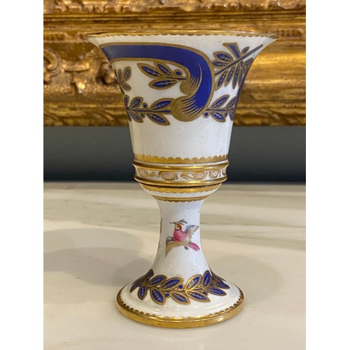 45 - An 18th Century (?) painted and gilded porcelain extended urn shape small vase, with birds and foila... 