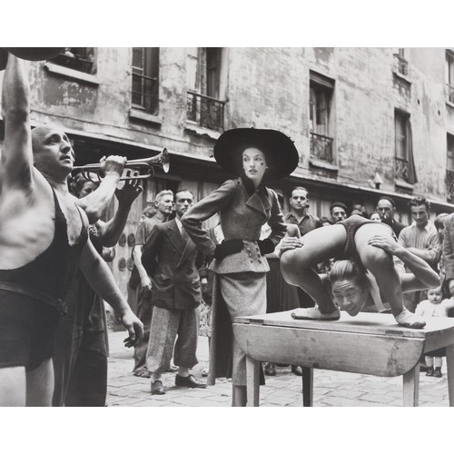 15 - Richard Avedon (1923 - 2004)Elise Daniels with Street Performers, Suit by Balenciaga, Le Marie, Pari... 