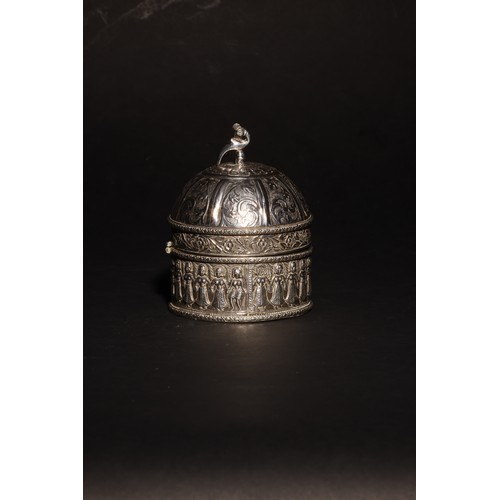 17 - An antique South Asian domed silver casket.With a stylised peacock finial.Floral and vegetal motif f... 