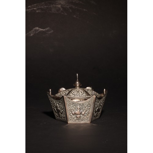 18 - An antique South Asian hexagonal silver casket with a lid. The lid with pointed central finial and s... 