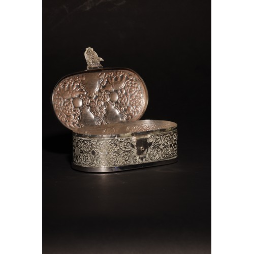 23 - An antique South Asian lidded squircle silver casket with a handle and clasp.The lid with two elepha... 