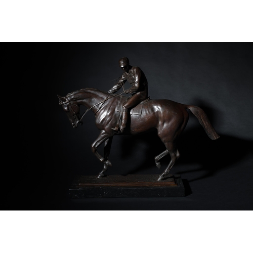 147 - To be sold without reserveProperty of Sir Christopher OndaatjeA bronze horse with jockeyOn a marble ... 