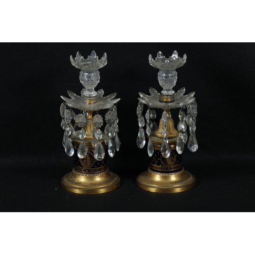 165 - Property of a gentleman19th CenturyA pair of ormolu-mounted, blue glass and gilded glass candlestick... 