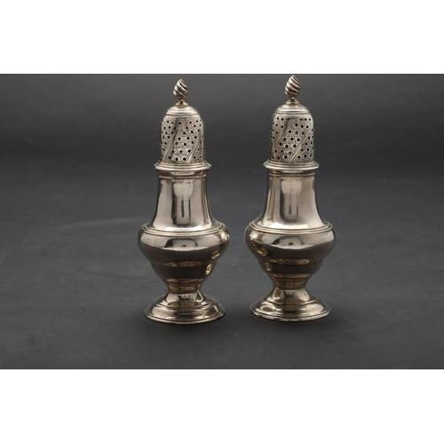 177 - Property of a ladyS&SN1899A pair of plain silver castersEach with pierced dome covers with wryth... 