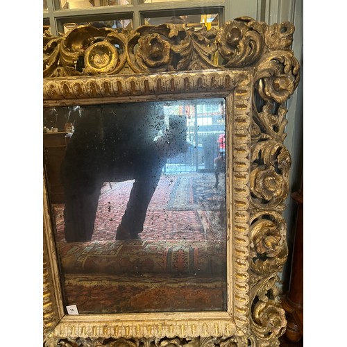 16 - Property of a gentlemanFlorentine17th/18th CenturyGiltwood carved frame with antique mirror plateDim... 