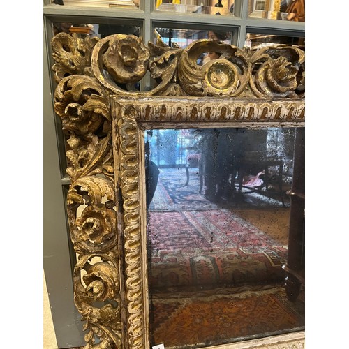 16 - Property of a gentlemanFlorentine17th/18th CenturyGiltwood carved frame with antique mirror plateDim... 