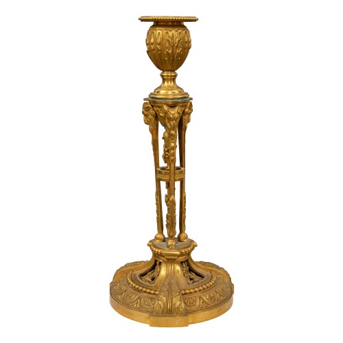 186 - Property of a ladyFrenchc. 1820A pair of Restauration ormolu candlesticksEach with a pierced tripart... 