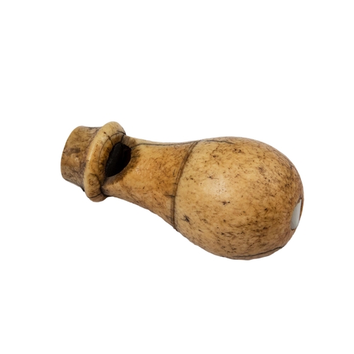 40 - Property of a gentlemanA group of 10 objects, including some of Inuit origin

a carved bone whistle ... 