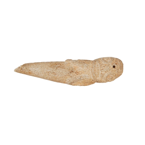 40 - Property of a gentlemanA group of 10 objects, including some of Inuit origin

a carved bone whistle ... 