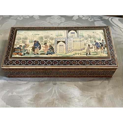 110A - Property of a ladyPersian20th CenturyA wooden casket with a scene of music and dancingDimensions:2.7... 