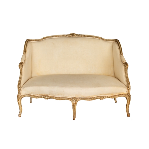 54A - Property of a LadyFrench18th CenturyA serpentine upholstered canapé, with carved floral and shell mo... 