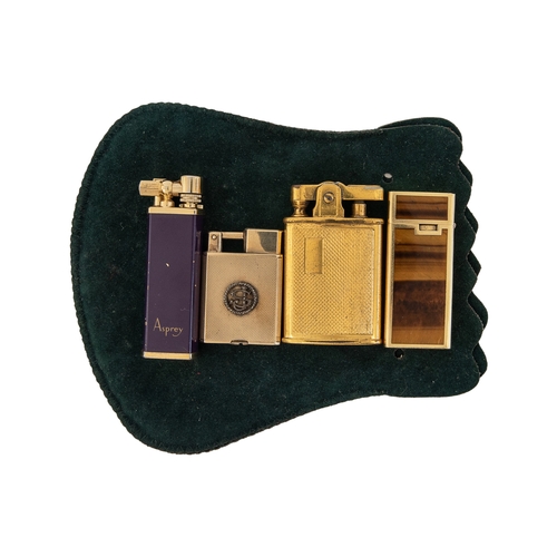 100 - To be sold without reserve Property of a LadyA collection of 4 antique lighters[a] An 18ct yellow go... 