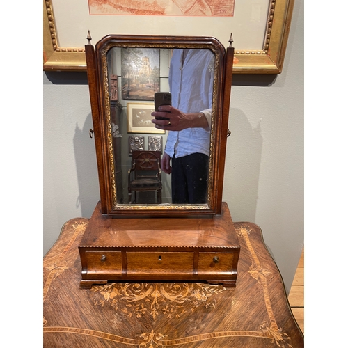 450A - To be sold without reserveProperty of a GentlemanA dressing table mirrorWith carved giltwood rim and... 