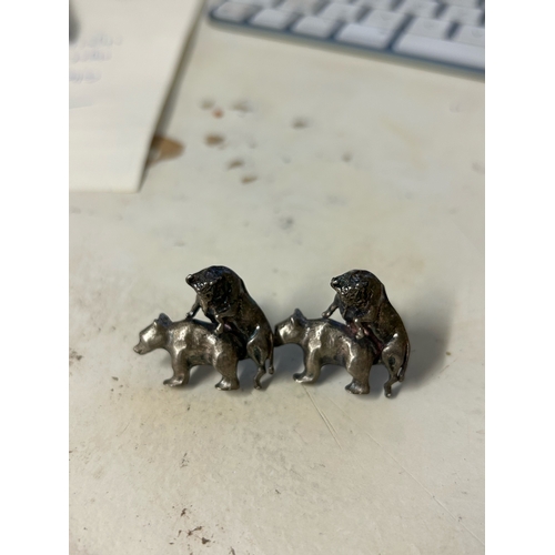 469 - To be sold without reserveProperty of a LadyA pair of cast silver coloured metal bear and bull cuffl... 