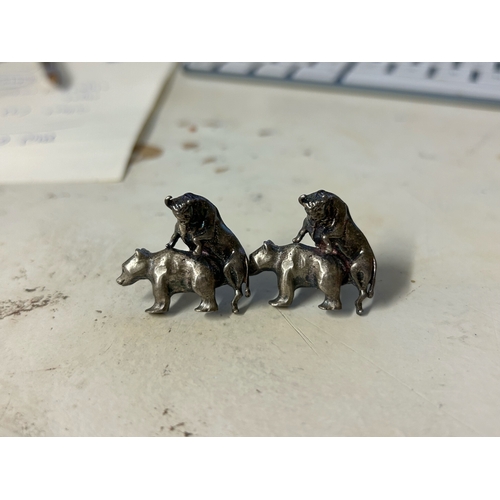 469 - To be sold without reserveProperty of a LadyA pair of cast silver coloured metal bear and bull cuffl... 