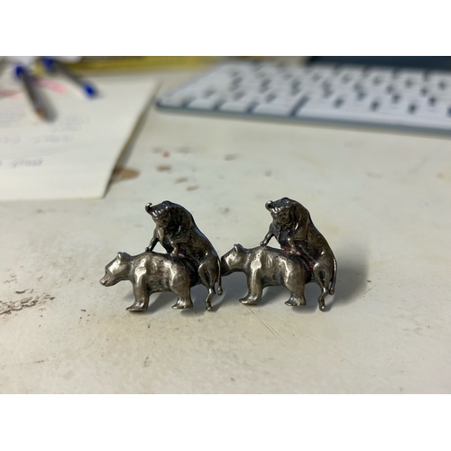 469 - To be sold without reserveProperty of a LadyA pair of cast silver coloured metal bear and bull cuffl... 