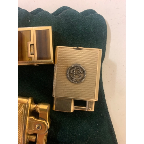 100 - To be sold without reserve Property of a LadyA collection of 4 antique lighters[a] An 18ct yellow go... 