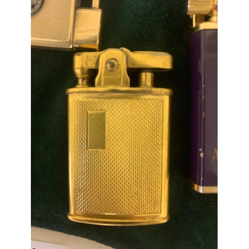 100 - To be sold without reserve Property of a LadyA collection of 4 antique lighters[a] An 18ct yellow go... 