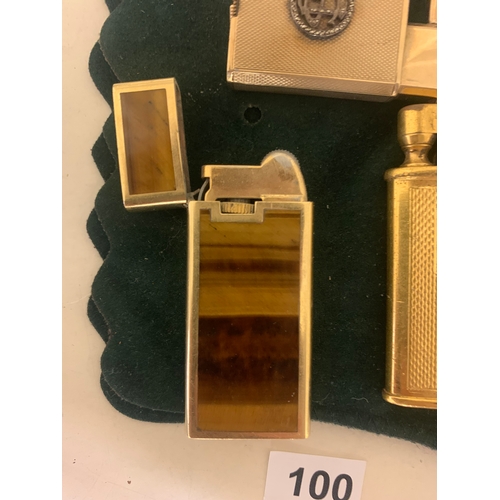 100 - To be sold without reserve Property of a LadyA collection of 4 antique lighters[a] An 18ct yellow go... 