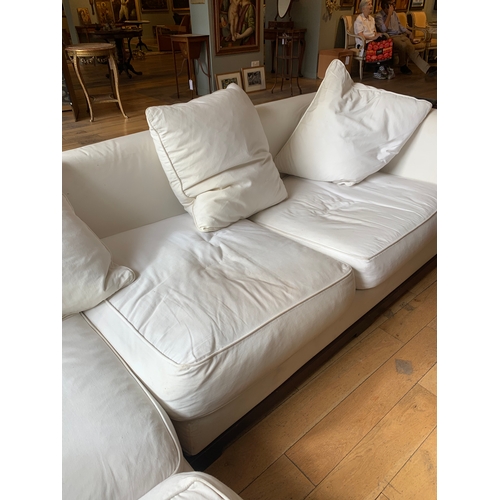54 - Property of a LadyPromedoriaA pair of white upholstered sofasDimensions:28 in. (H) x 85 in. (W) x 38... 