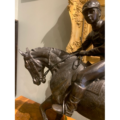 88 - Property of a Gentleman20th CenturyA large bronze of a jockey on horsebackCast bronzeDimensions:22 i... 