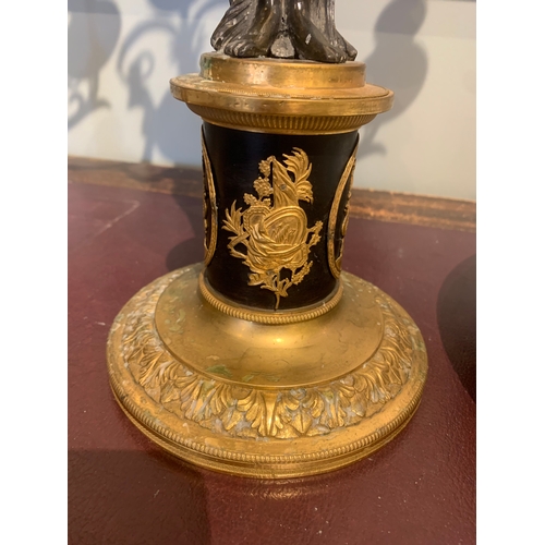 94 - Property of a GentlemanFrench EmpireA pair of patinated brass and ormolu figural candlesticksDimensi... 