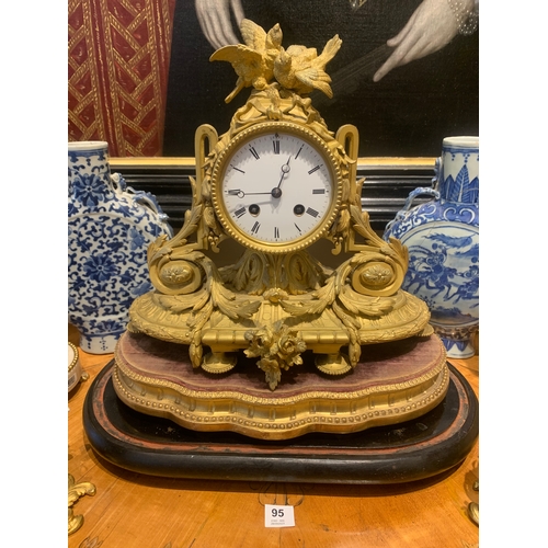 95 - Property of a GentlemanFrench19th CenturyA gilt bronze mantle clockOn an ebonised wood baseRecently ... 