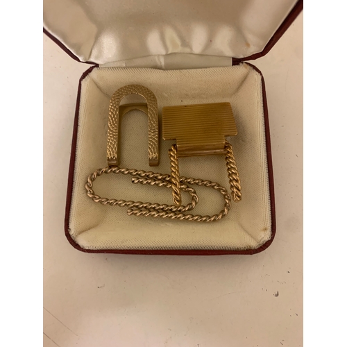 98 - Property of a LadyA set of three money clips[a] A 9ct yellow gold engine turned and roped twist mone... 