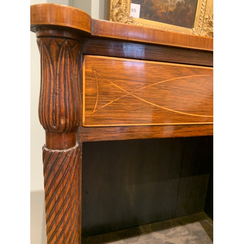 16 - RegencyA pair of mahogany glazed side cabinets, with twist scrolled columns capped with foliate carv... 