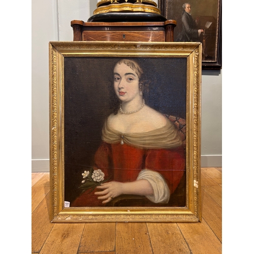 127 - Property of a GentlemanFrench School16th/17th CenturyPortrait of a girl holding a white carnationOil... 