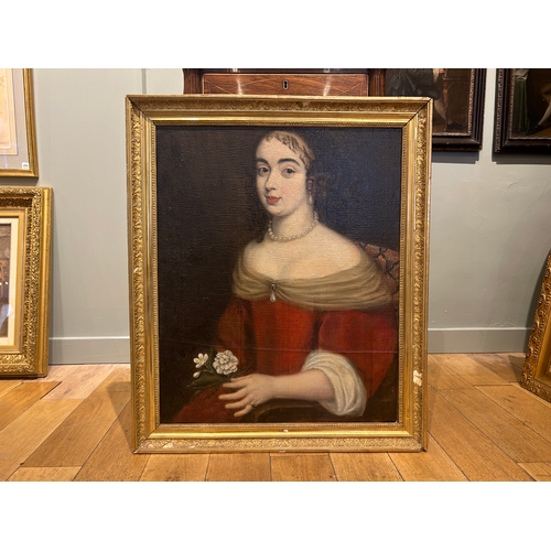 127 - Property of a GentlemanFrench School16th/17th CenturyPortrait of a girl holding a white carnationOil... 