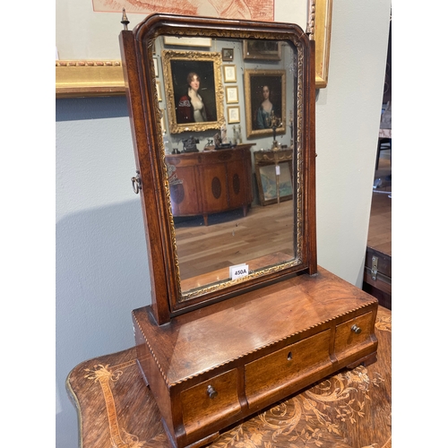 450A - To be sold without reserveProperty of a GentlemanA dressing table mirrorWith carved giltwood rim and... 