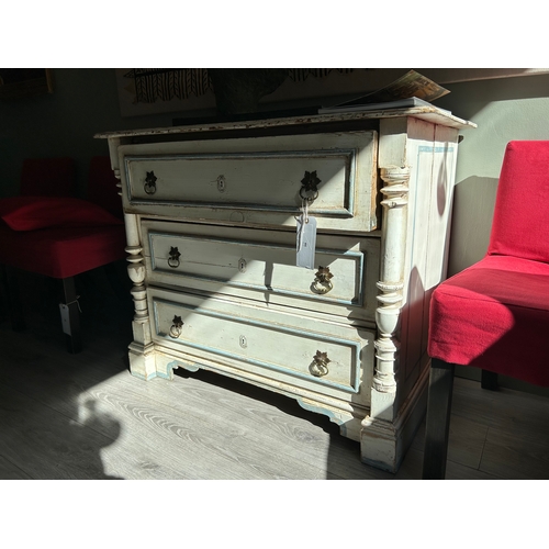 46 - Property of a LadyA distressed white chest of drawers, with painted blue detailDimensions:32 in. (H)... 