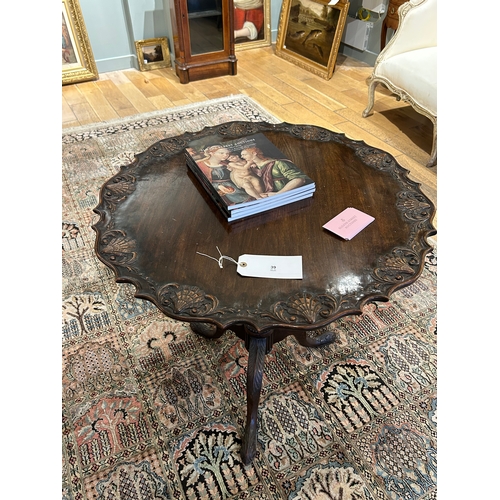 39 - Property a GentlemanEarly 19th CenturyA tilt-top tripod mahogany wine table with carved shell motifD... 