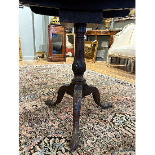 39 - Property a GentlemanEarly 19th CenturyA tilt-top tripod mahogany wine table with carved shell motifD... 