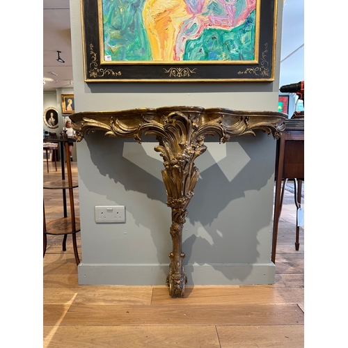 38A - Property of a Lady 18th/Early 19th CenturyA serpentine giltwood marble top console table (new marble... 