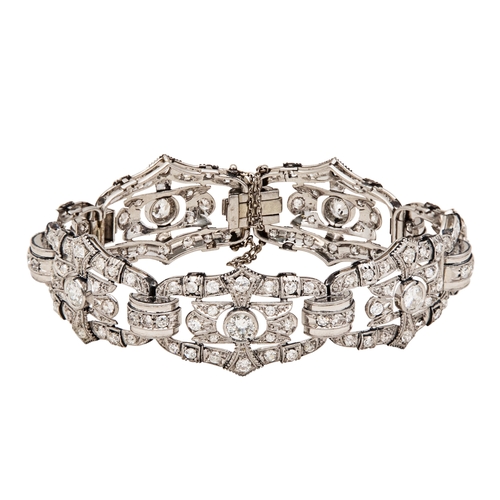 62 - Art DecoA diamond and platinum braceletComprising seven architectural style panels with larger centr... 