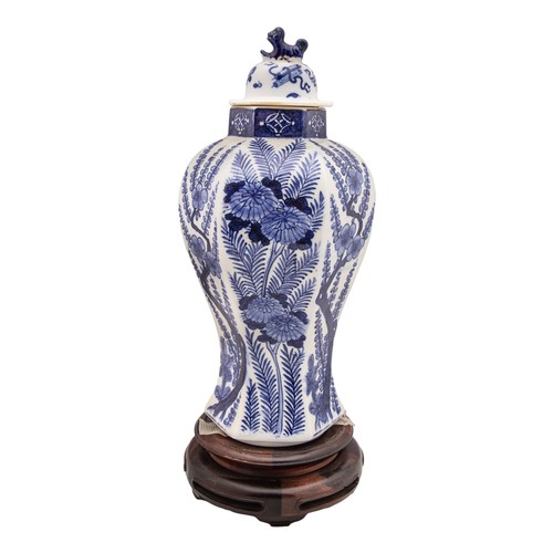 457 - 19th CenturyA blue and white lidded porcelain vaseThe body decorated with ferns and plum blossomsThe... 