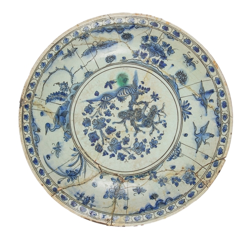 468 - Safavid17th CenturyA large blue and white pottery dish (with damages)Property of an academic collect... 