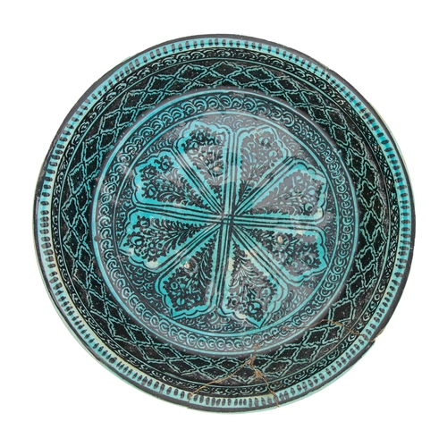 482 - Timurid15th CenturyA turquoise and black deep pottery bowlProperty of an academic collectorDiameter:... 