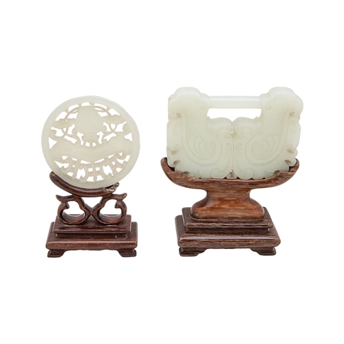 493 - ChinaEarly 20th CenturyA pair of carved jade/jadeite items[a] A Chinese whitish Jade plaque with sta... 