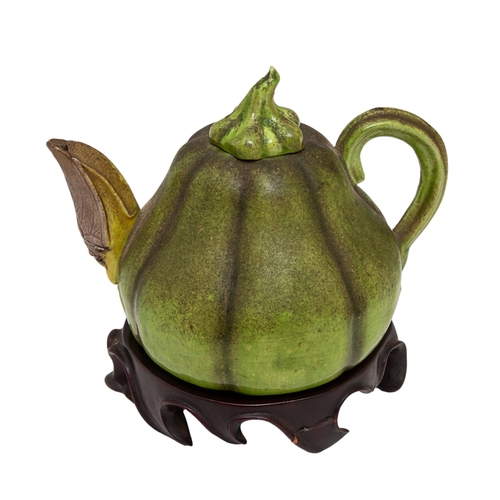 494 - 18th Century or earlierA Chinese gourd teapot with locust spout Realistically modelled with a green ... 